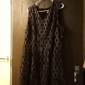 Black and Gold Party Dress by Monroe and Main. Looks stunning with a belt.